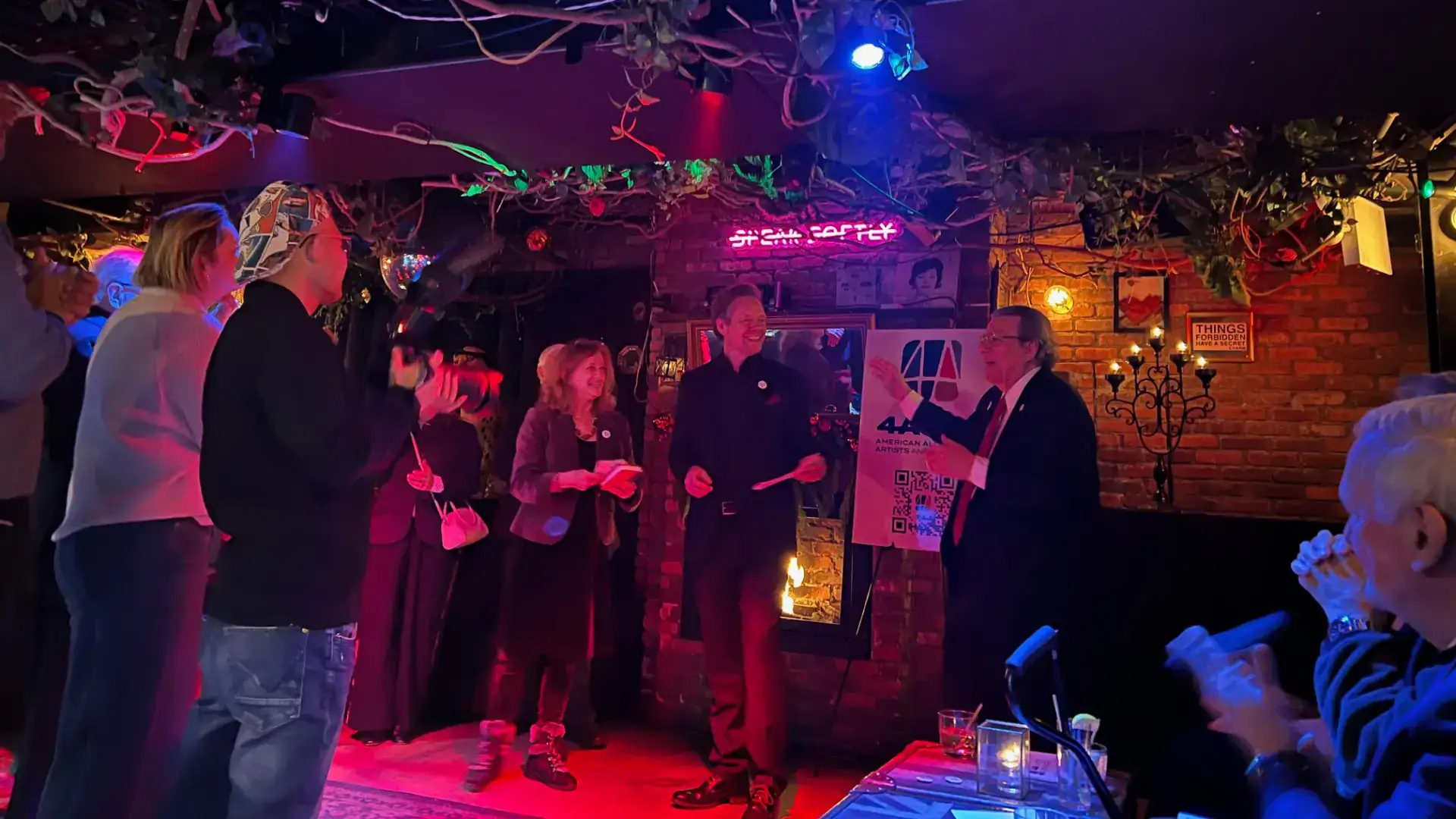 Board member Luis Cancel laughs with Joy Javits and Gavin Lodge