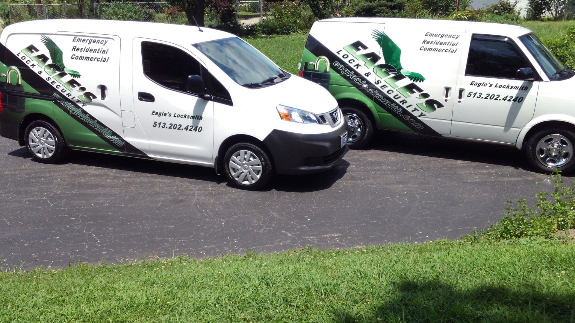 Two Eagle's Locksmith Cincinnati fully equipped mobile service trucks parked together, representing professional residential and commercial locksmith services.