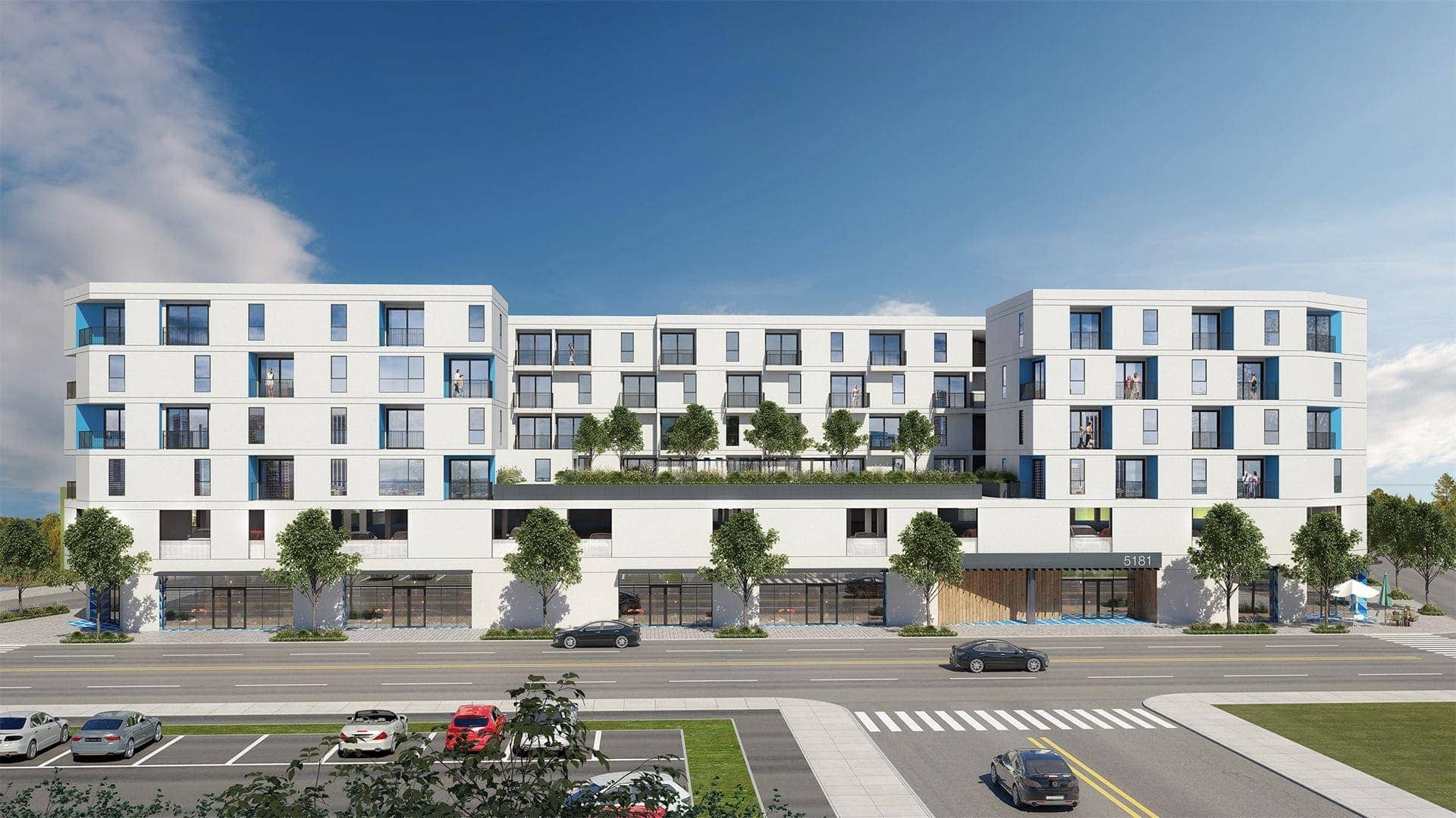 Modern residential apartment building exterior with landscaped terraces and retail spaces on the ground floor.