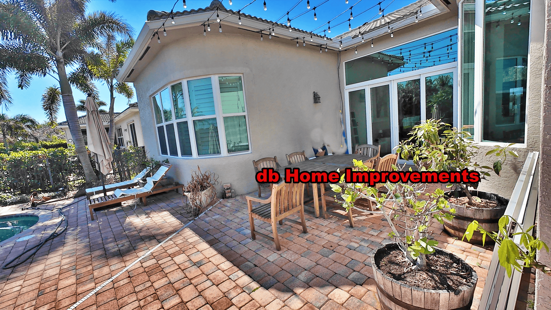 impact-sliding-patio-doors-curved-window-stuart Premium impact sliding patio doors and custom curved window installation on a Stuart Florida home.