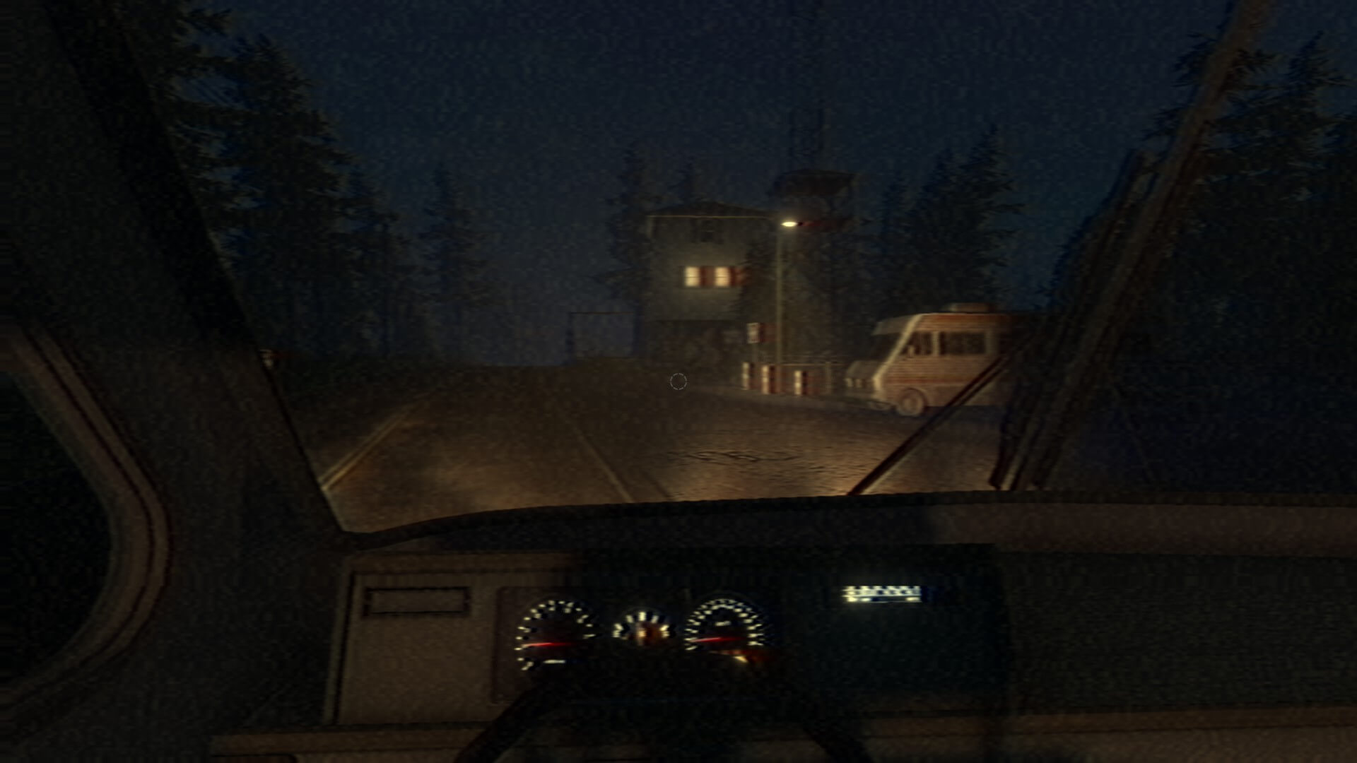 Player is sat in a van with the dash board lit up. In the distance is a tower which seems to have two windows lit up. A camper fan can be seen parked to the right.