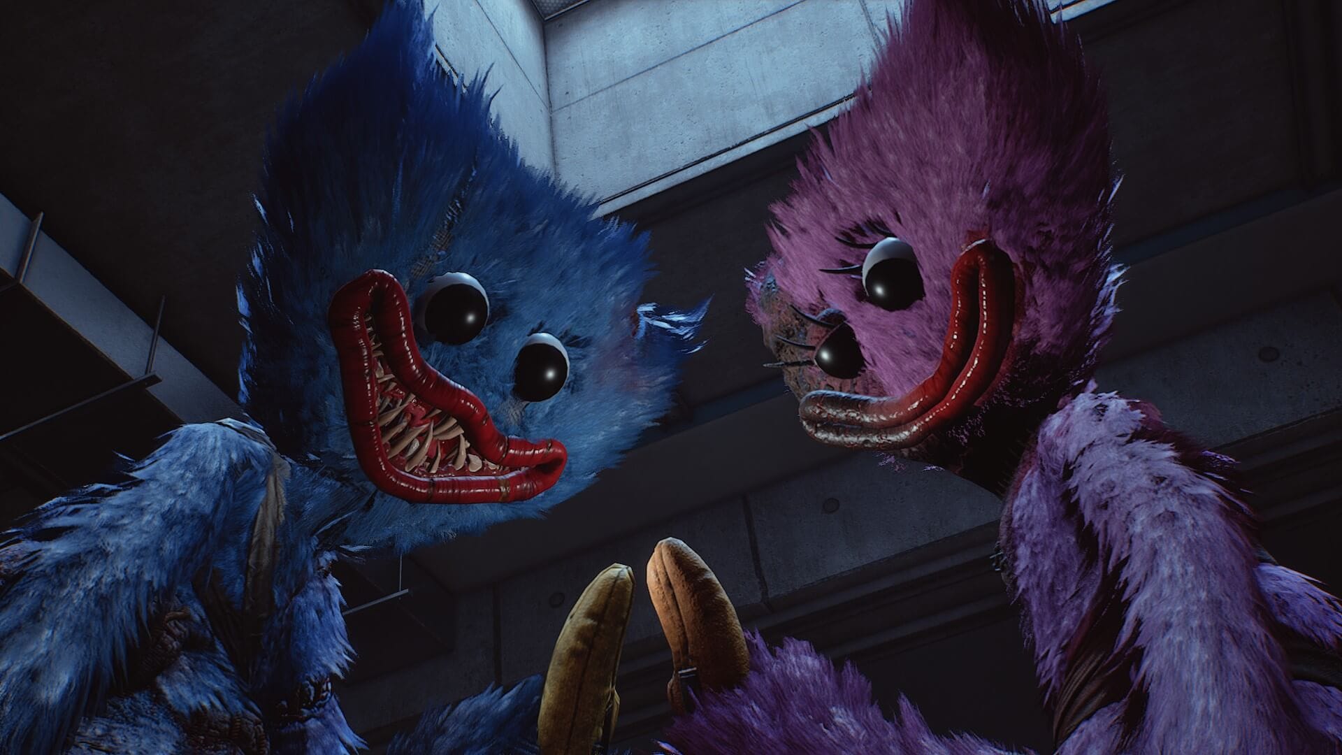 Two fuzzy, colorful creatures with large eyes and wide, toothy grins loom closely in a dimly lit room, creating an eerie and unsettling atmosphere.