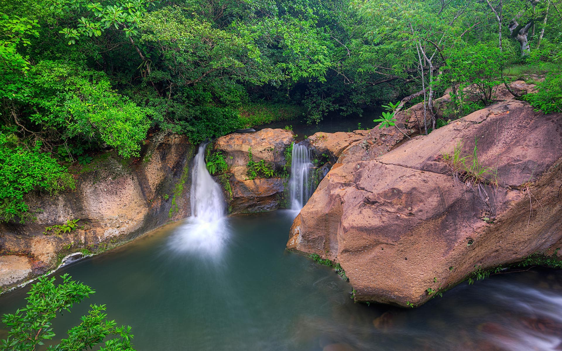 Tourists enjoying the ultimate One Day Adventure Pass at Hacienda Guachipelin in Guanacaste, Costa Rica.