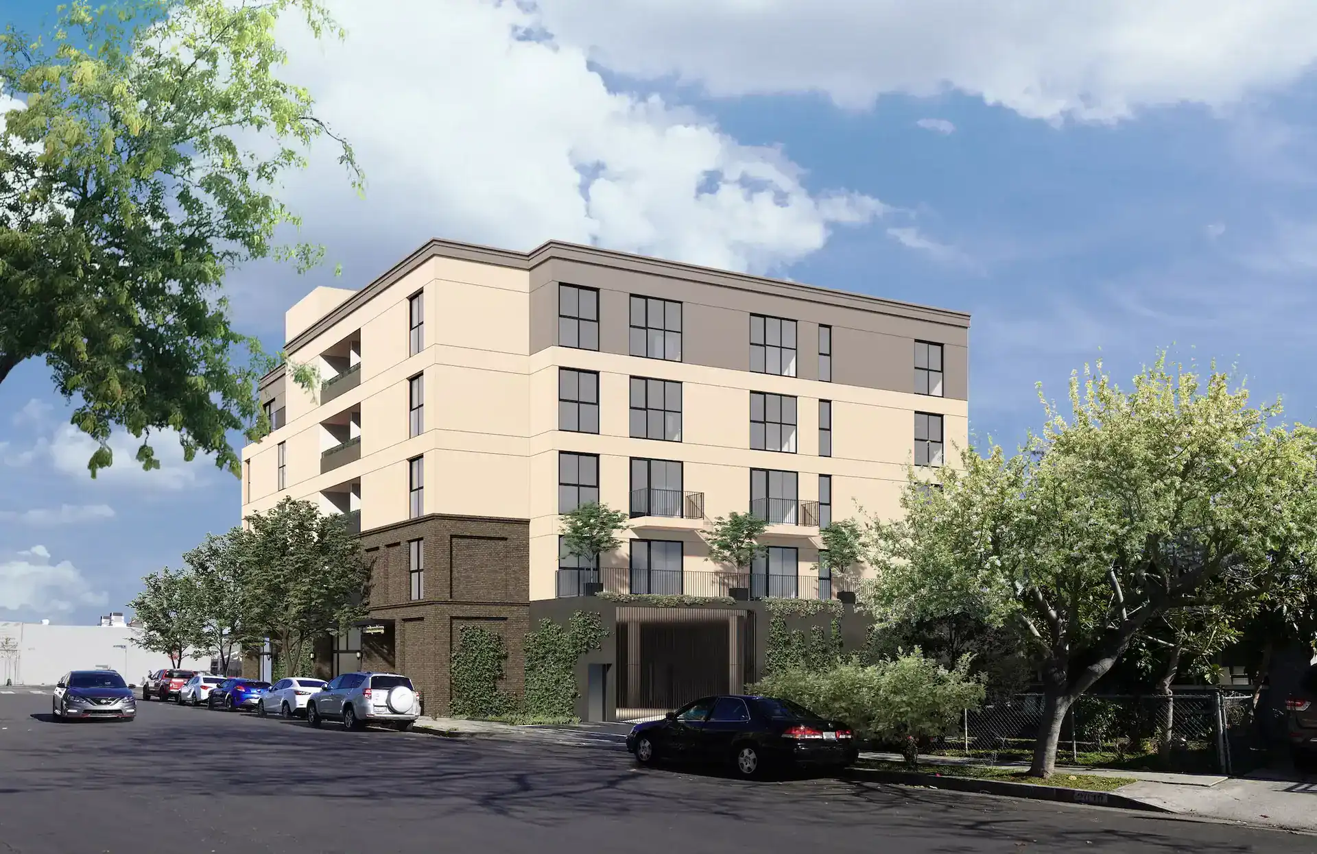 Modern residential apartment building with landscaped entry and parking area.