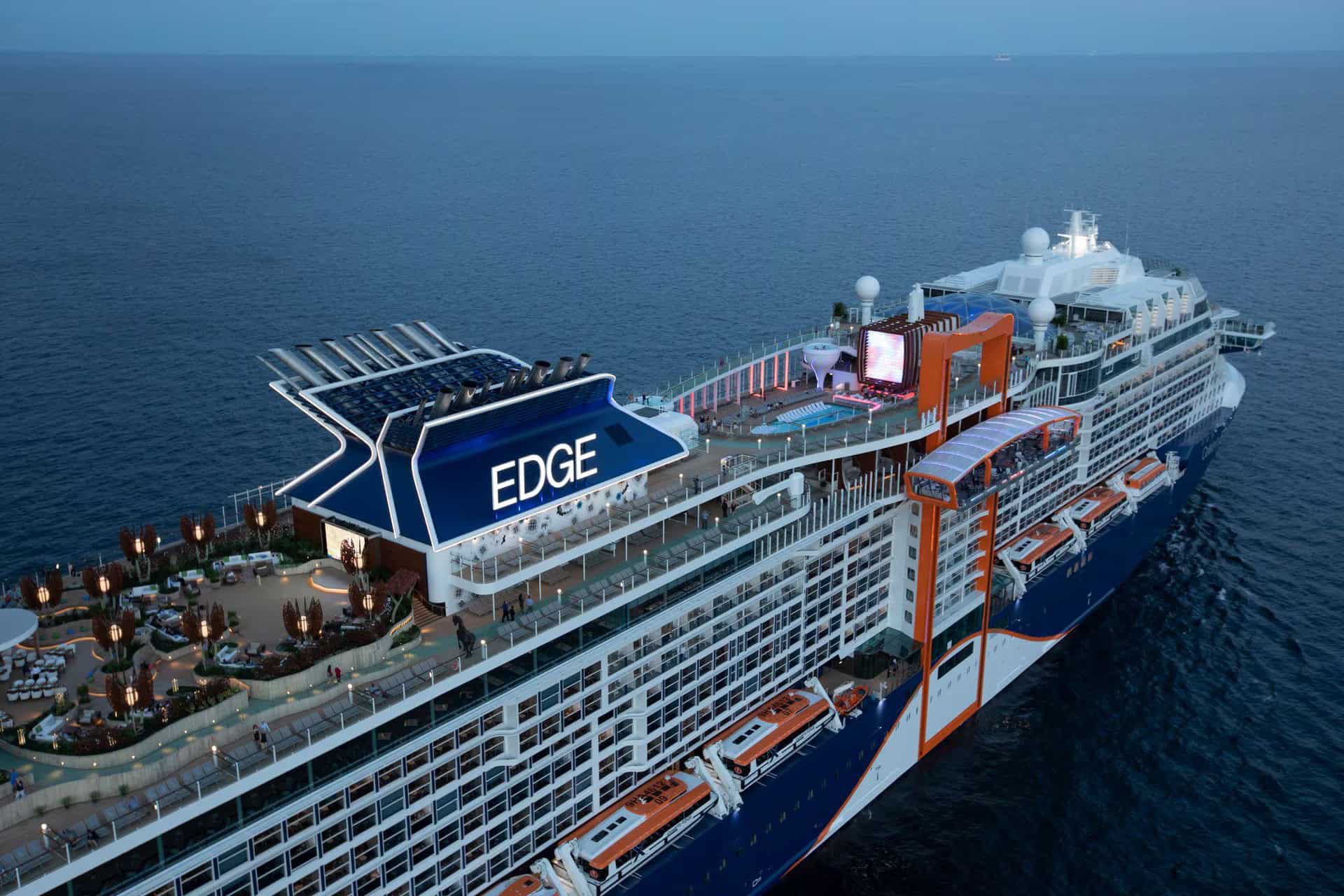 Edge cruise ship at sea with outdoor deck and amenities.