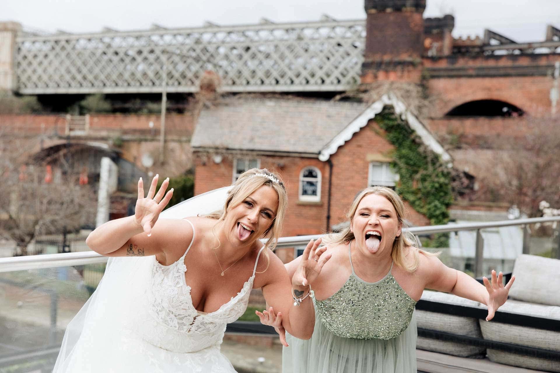 outside the castlefield rooms wedding venue guests gather for group photos
