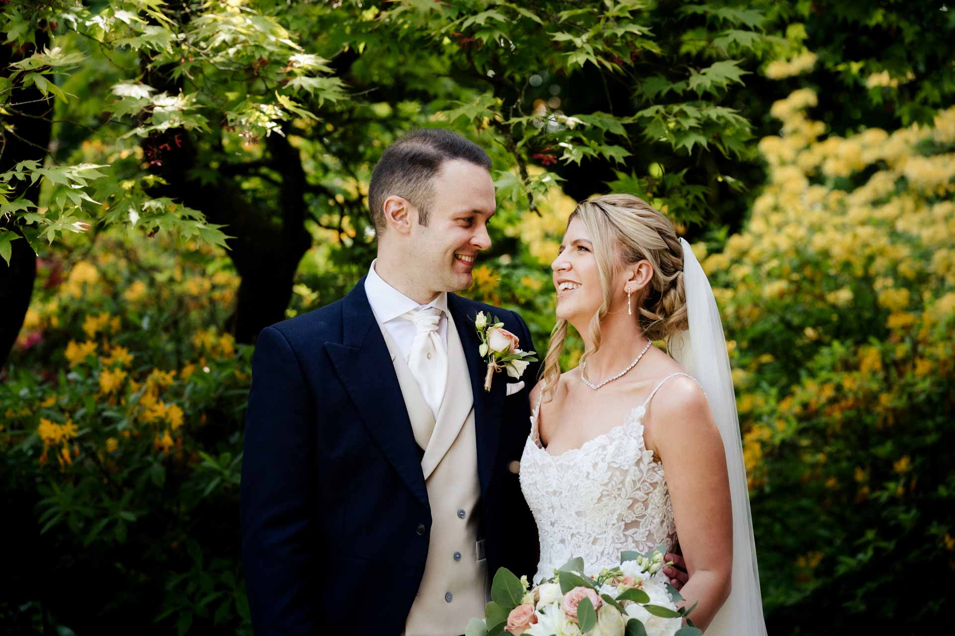 bride and groom portraits in the gardens at eaves hall lancashire