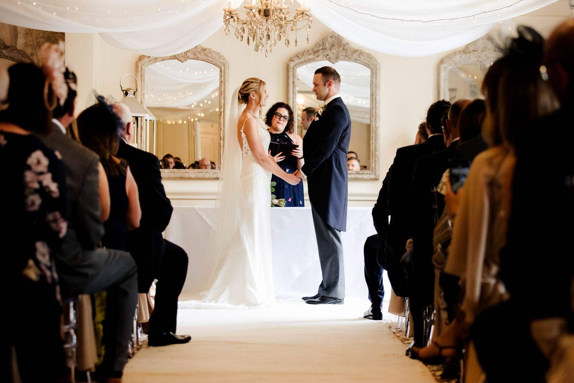 the wedding ceremony inside eaves hall wedding venue in lancashire