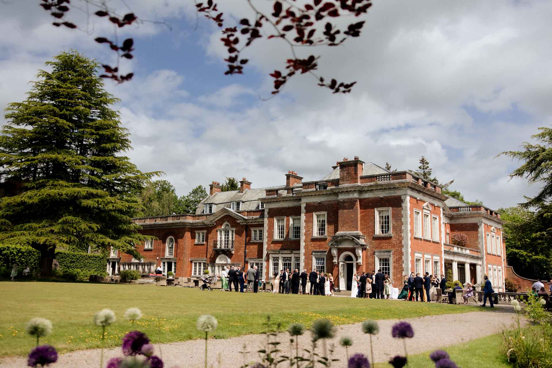 group photos outside in the grounds of eaves hall