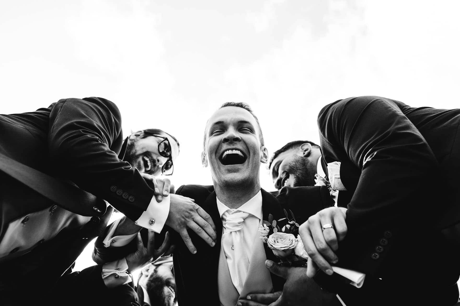 fun groomsmen photographs at eaves hall in lancashire