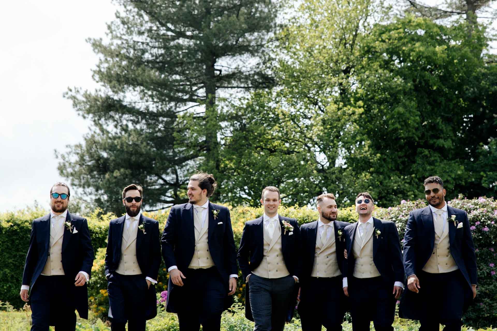 fun groomsmen photographs at eaves hall in lancashire
