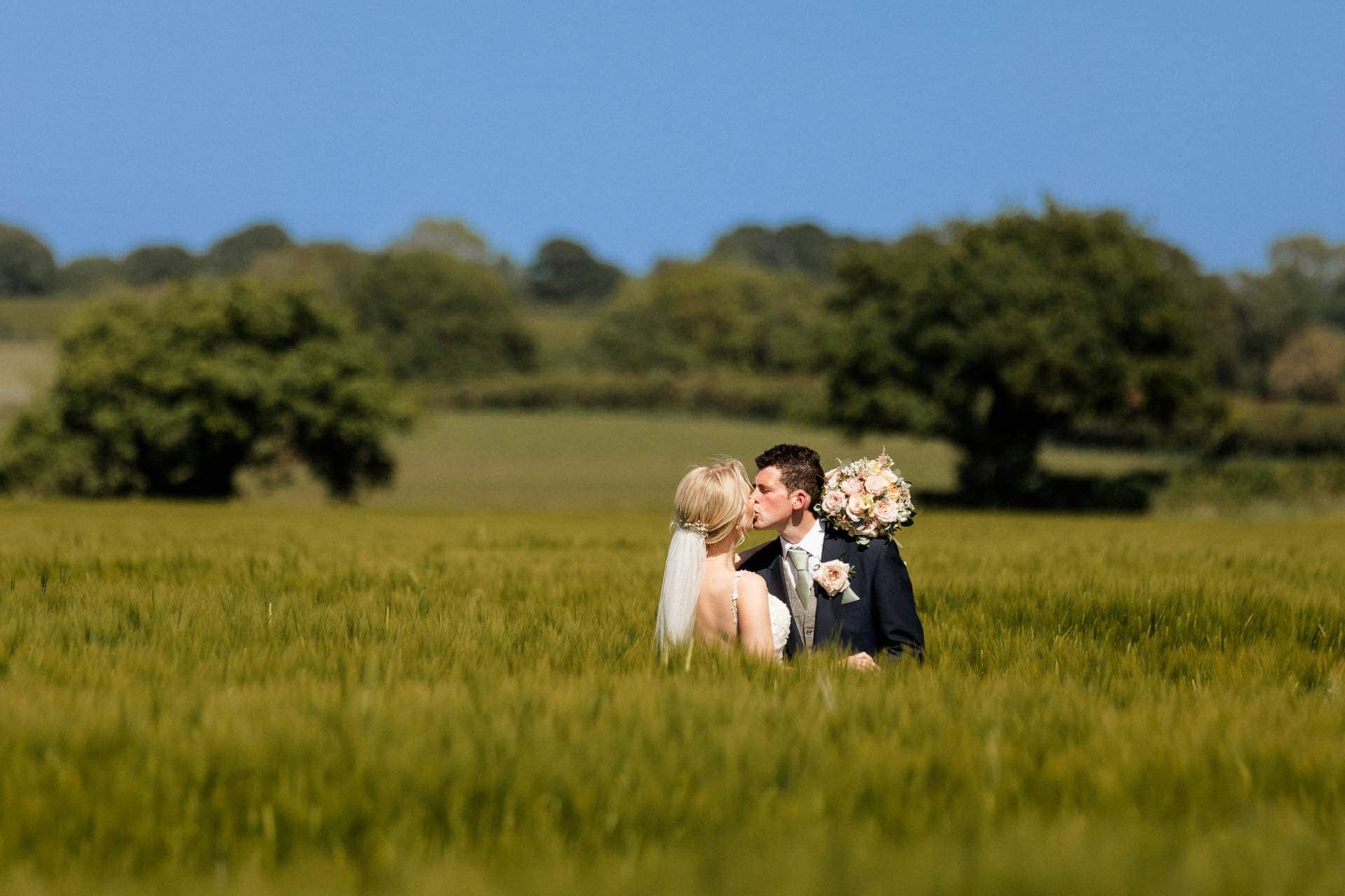 Farm wedding photography for megan and philip on their family farm in August.