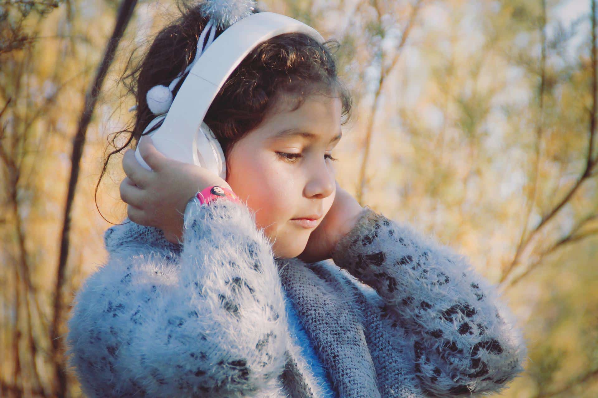 Little girl wearing headphones