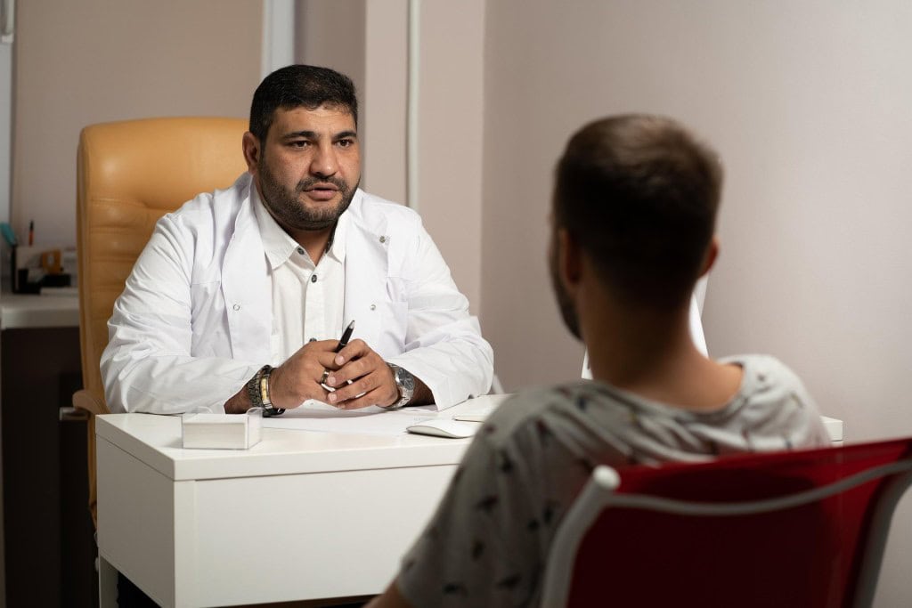 Patient in conversation with a doctor in a consultation room