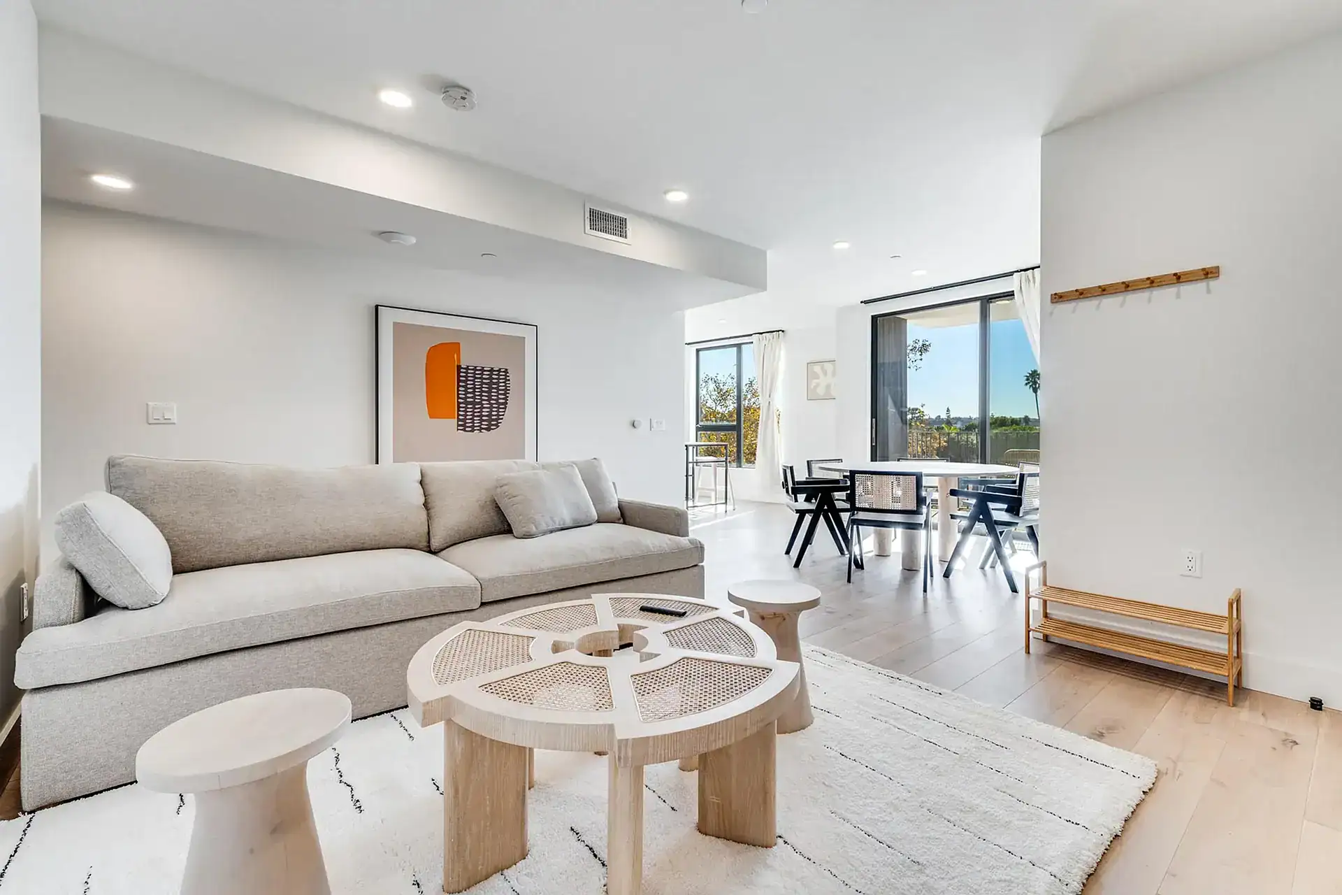 Modern residential living room interior with natural light and minimalist decor.