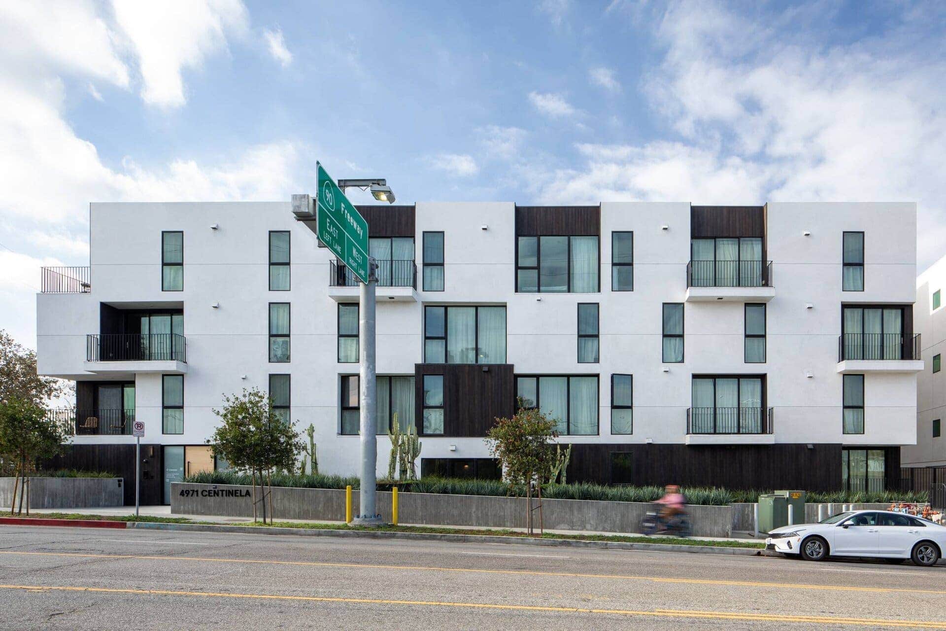 Contemporary multi-family residential building with modern design and clean lines.