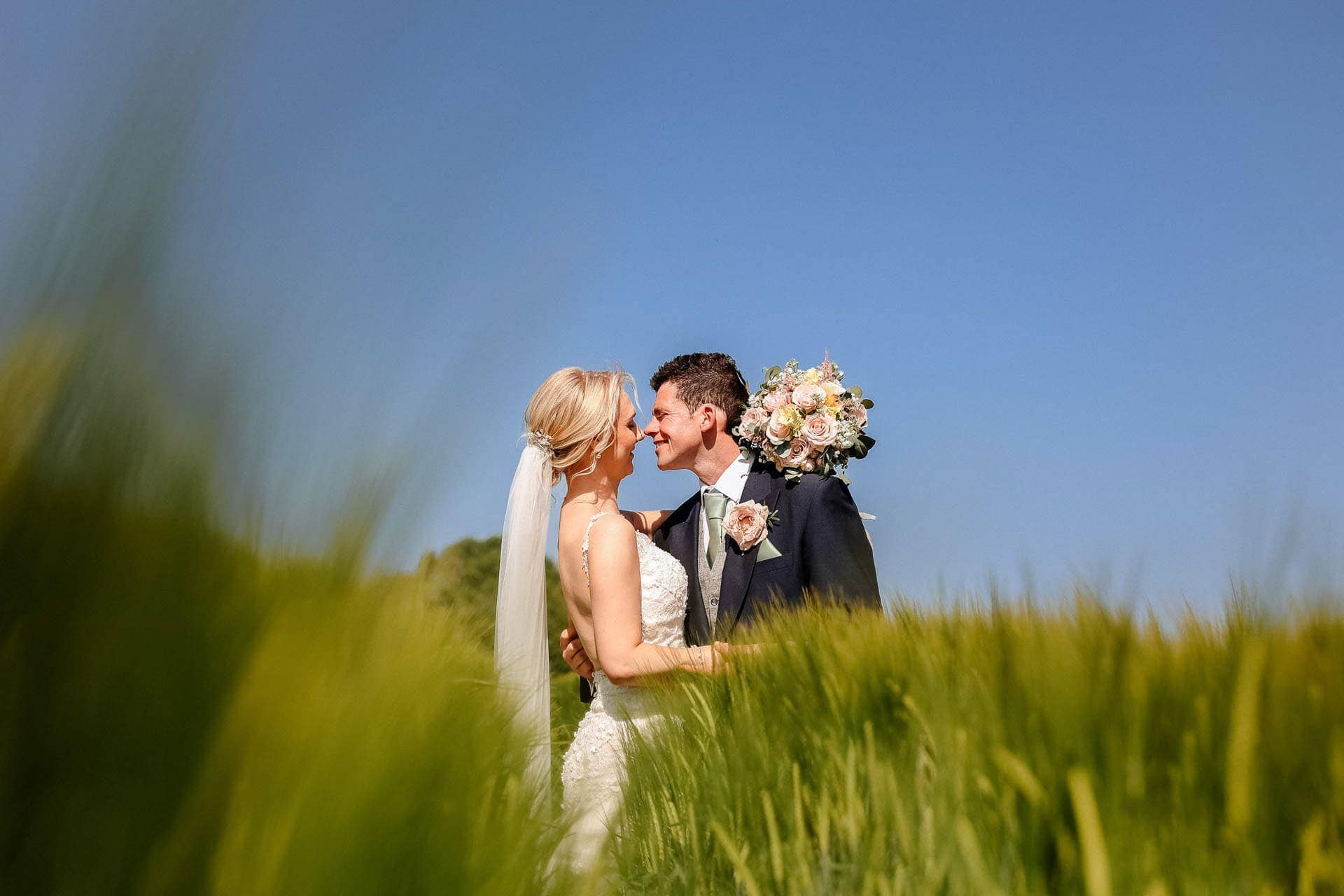 Farm wedding photography for megan and philip on their family farm in August.