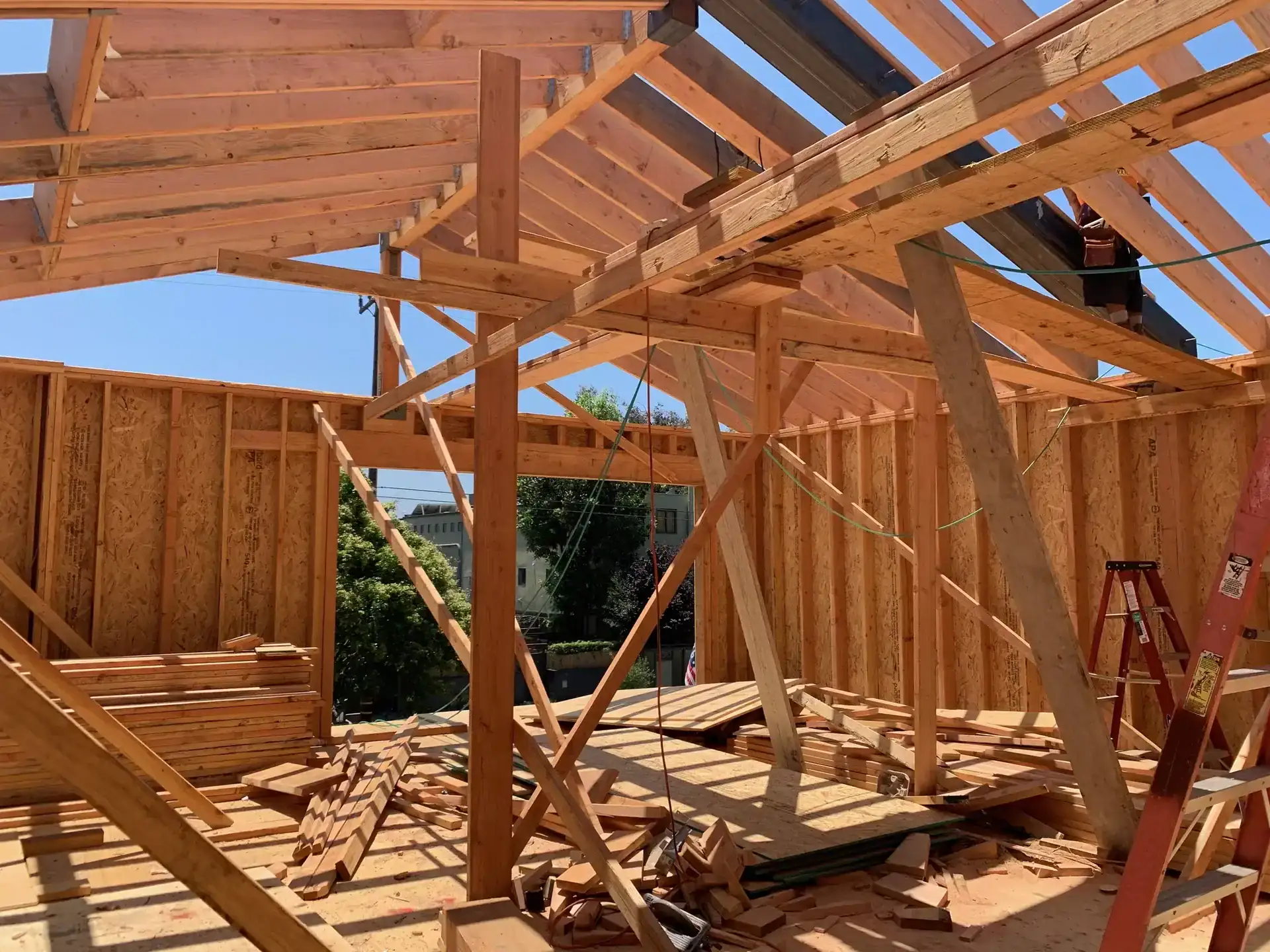 Wood framing under construction for a modern hillside residence in Los Angeles, showcasing indoor-outdoor living integration.