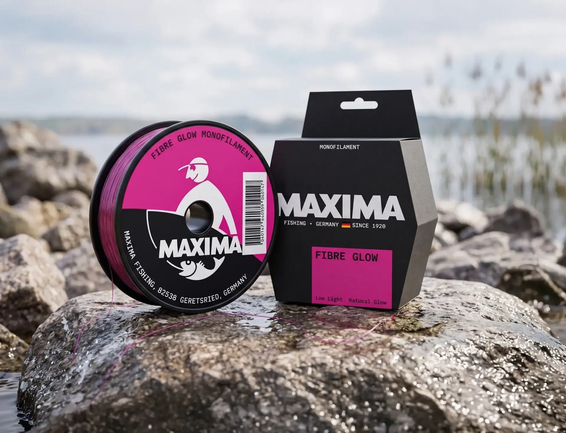 Several Maxima bronze Cristal Ivory monofilament fishing line spools on a sandy beach by the sea