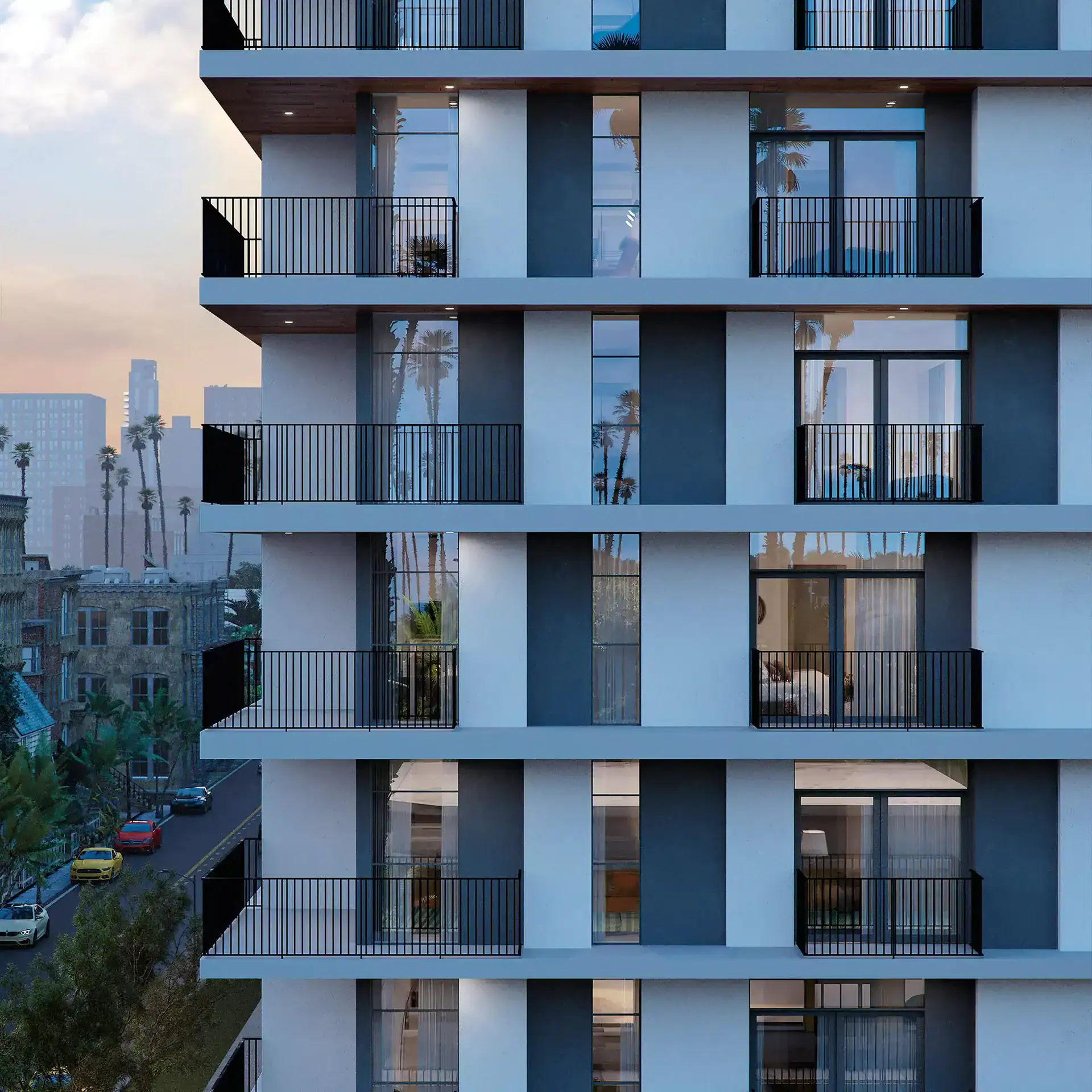 Modern residential apartment building façade with balconies and large windows.