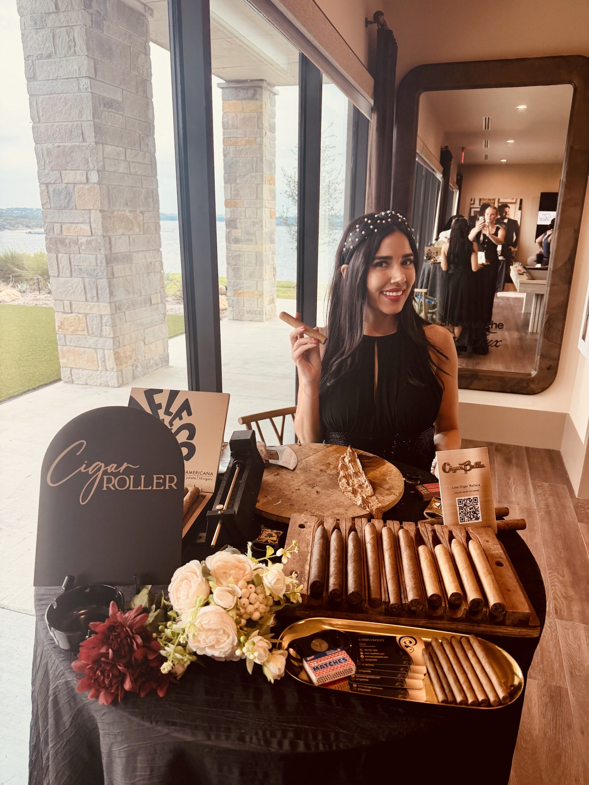 Live Cigar Rolling at a Waterfront Event Cigar Bella cigar roller at a private event station near a waterfront patio