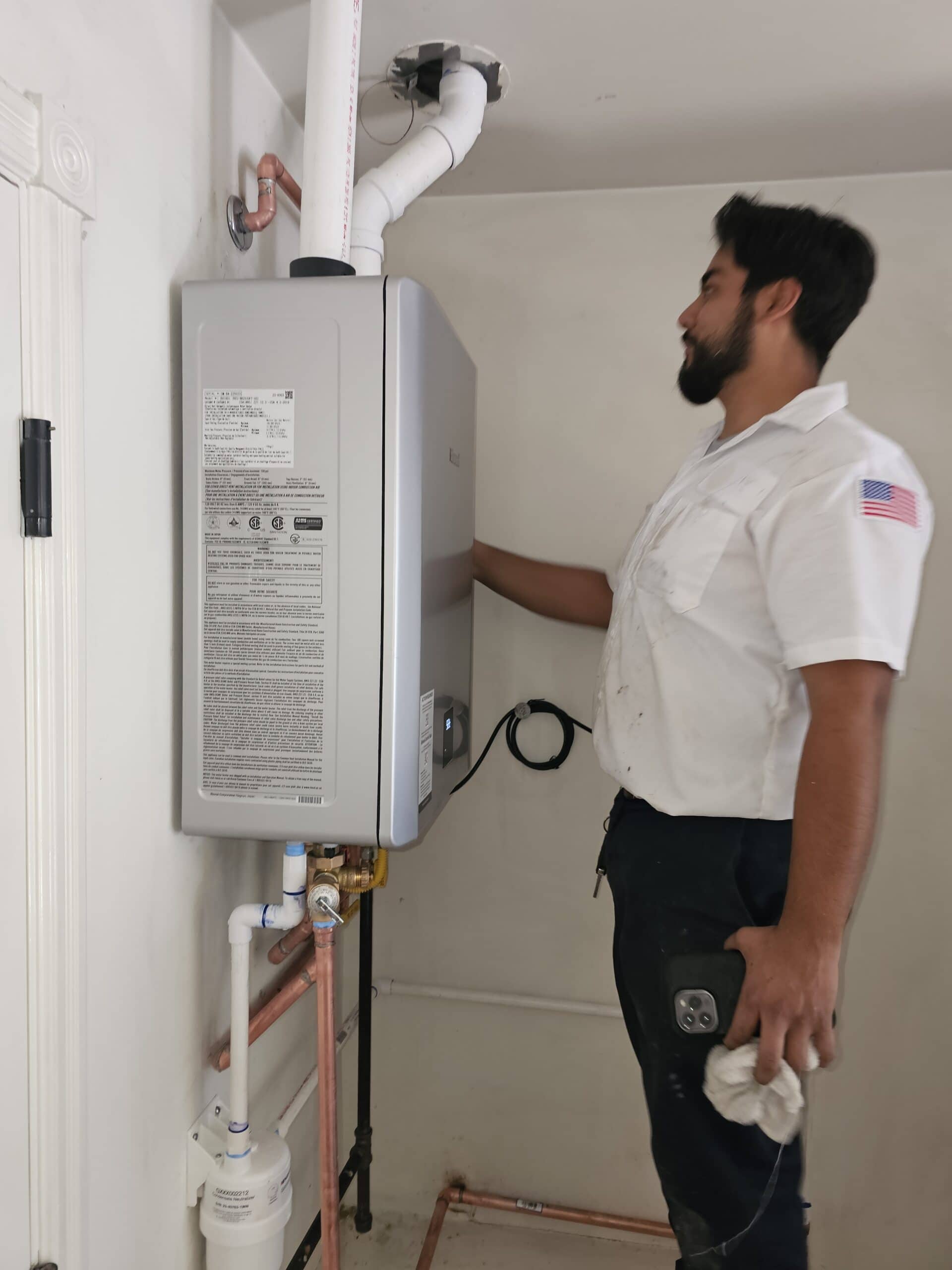 20250528_165143 technician installing a tankless water heater in burbank, ca