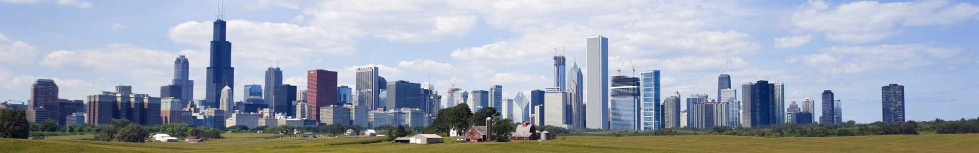 Expansive view of the Chicago skyline with large field in foreground