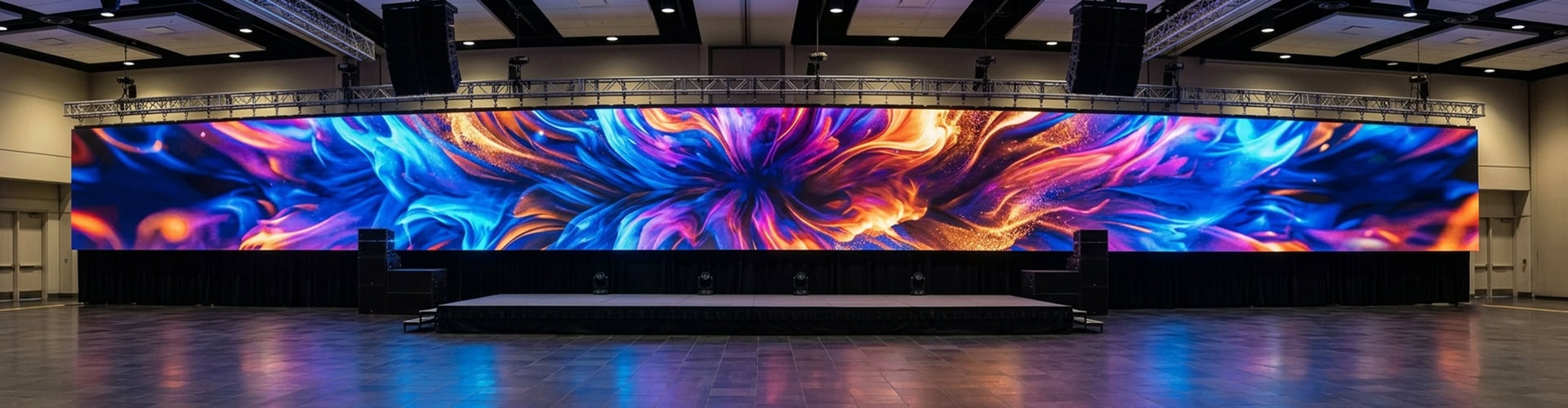 COB LED Display large seamless screen showing vibrant abstract fluid art in modern conference hall
