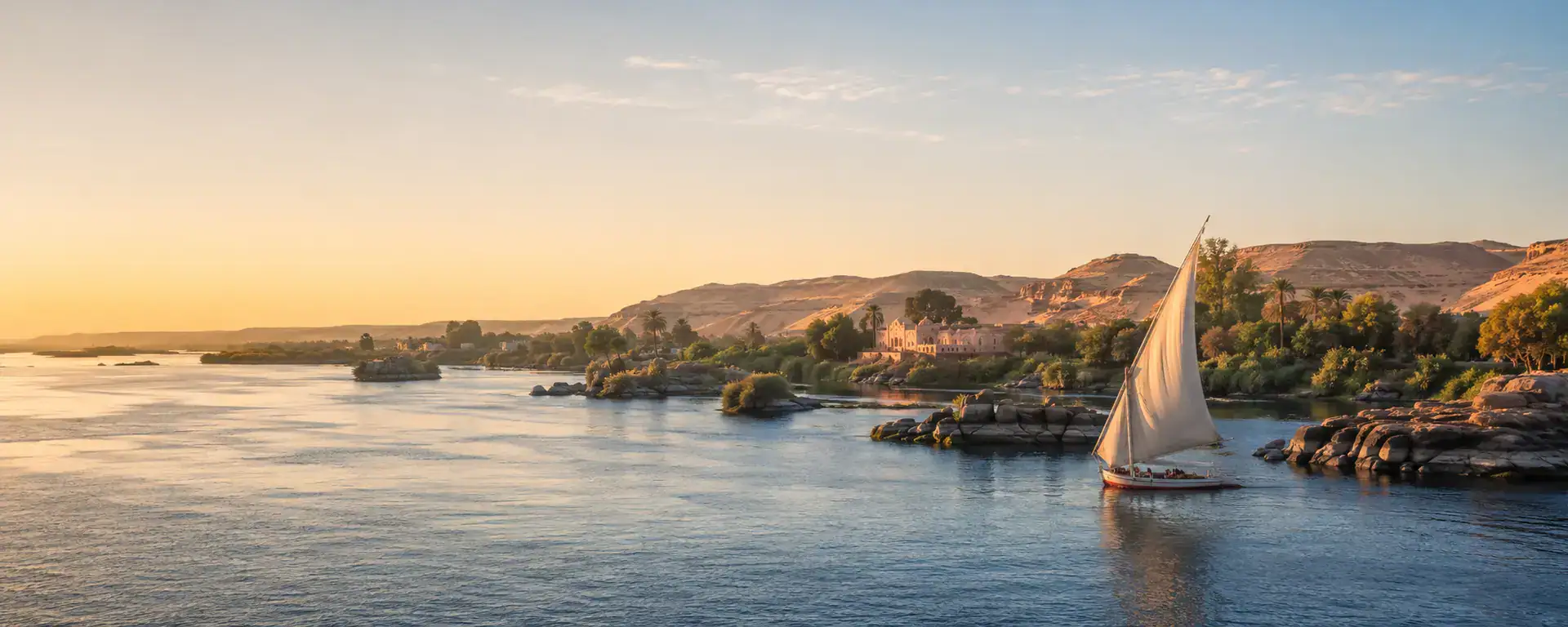 Aswan Egypt Nile landscape with a felucca sailing between islands