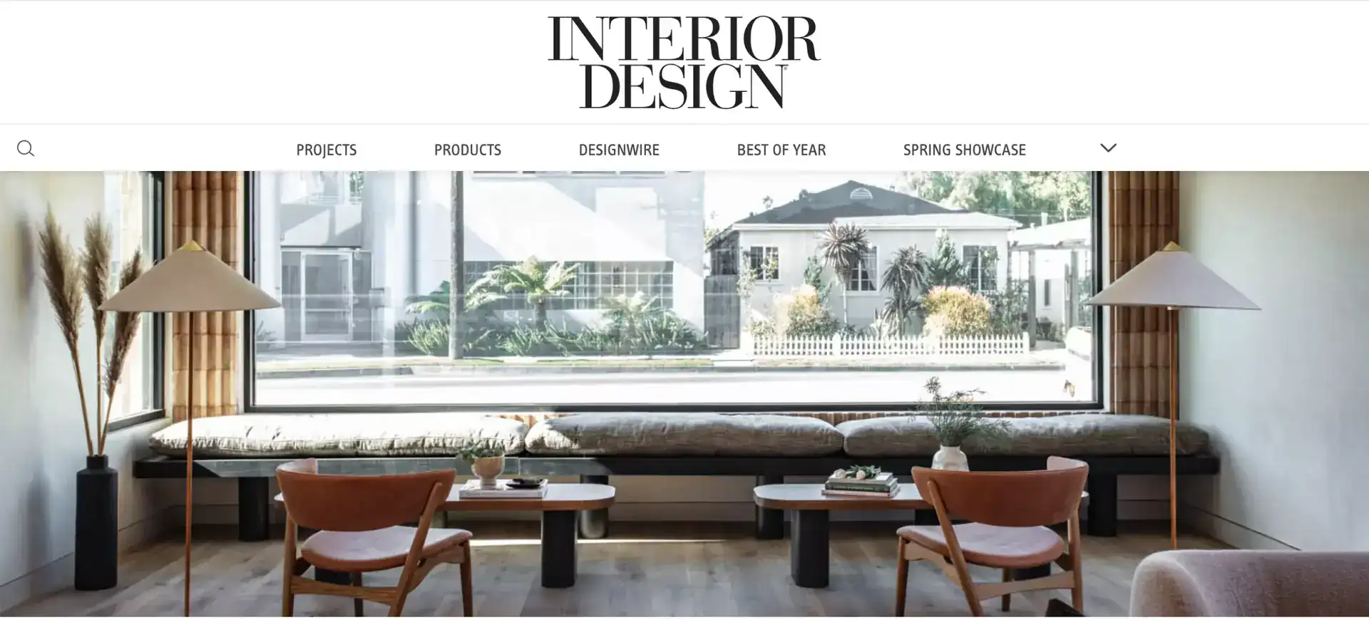 Modern interior living room with large window, natural light, minimalist decor, neutral tones, and wooden accents.