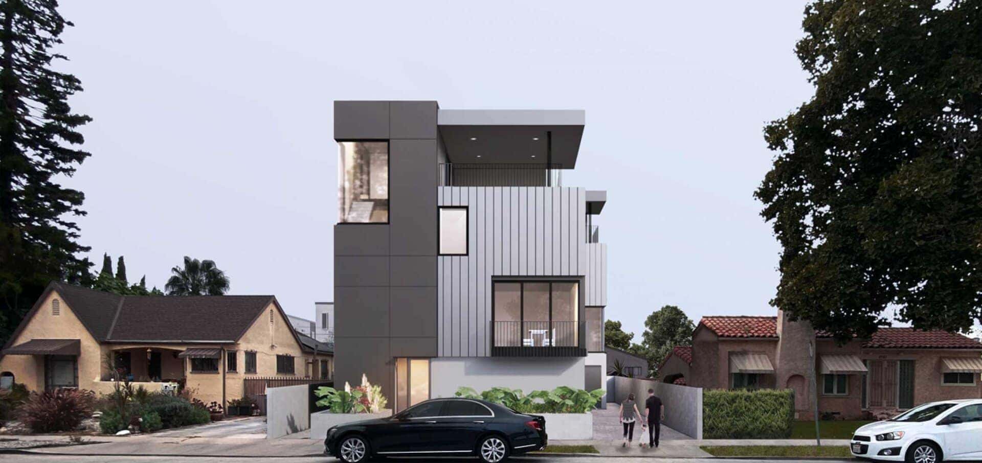Modern gray and white multi-story house with angular design and metal panel accents.