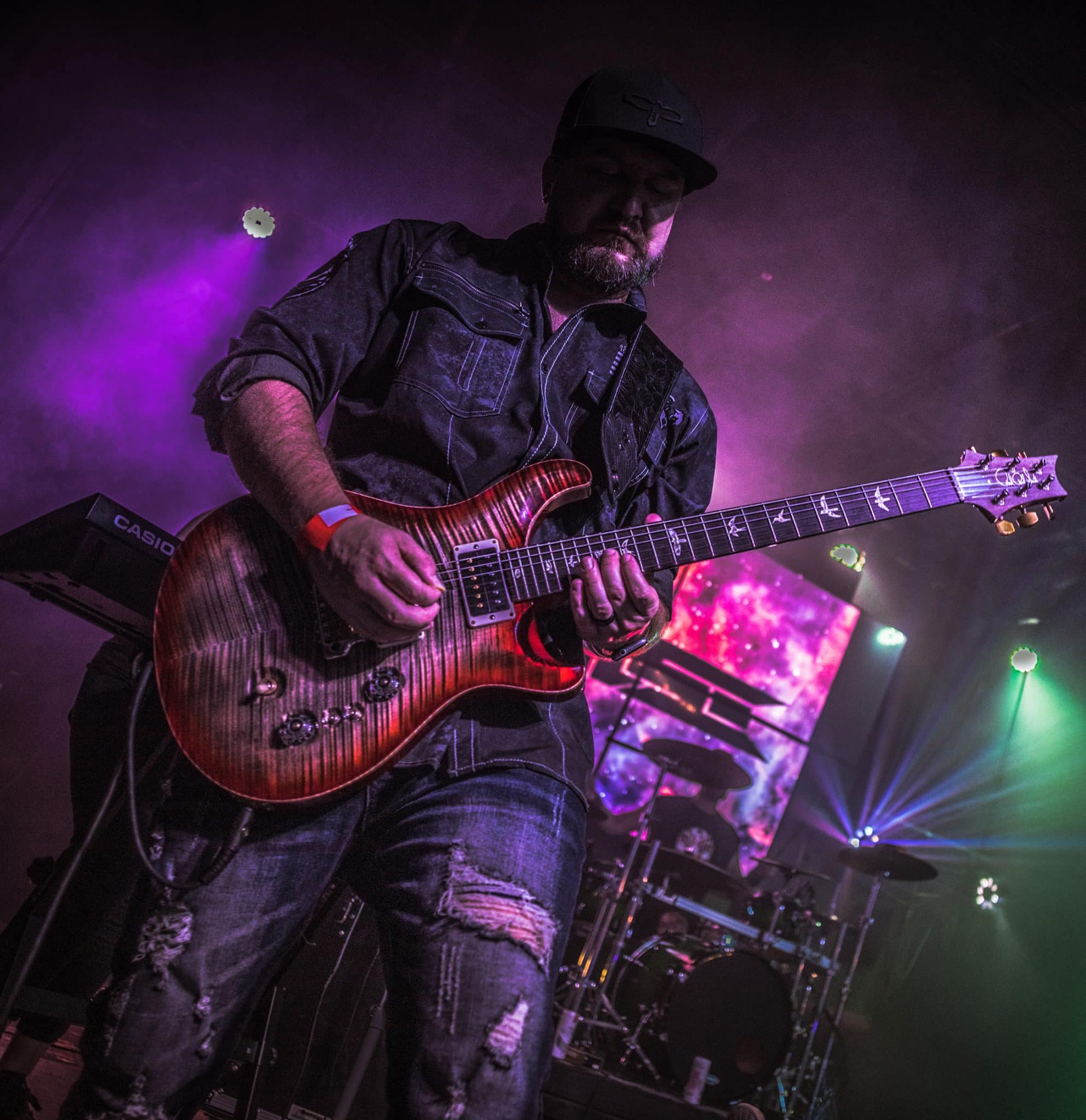 James Brennaman performing at the Rail Club, 2024, with his Charcoal Cherry Burst PRS Custom 24-08 - Photo by Kimbrel Studios