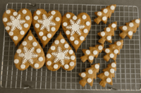 golden Christmas Gingerbread decorated with snowflakes and snow