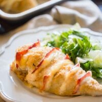 Baked Chicken Cordon Bleu featured image of chicken on plate with a salad