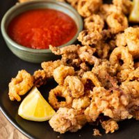 fried calamari with lemon and dipping sauce