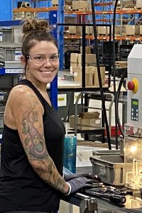 Employee working in Beecher production area
