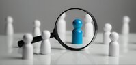 a magnifying glass looking to red wood people,Select a person in SAP_BasisTeam_Stelle