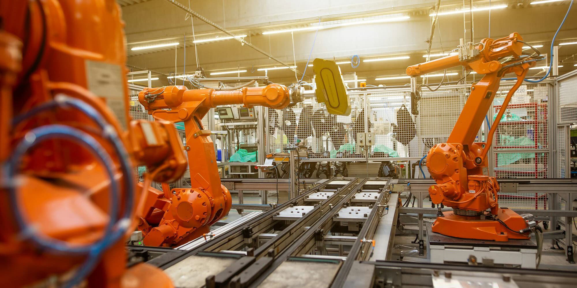 embodied AI models — a factory filled with lots of orange machines