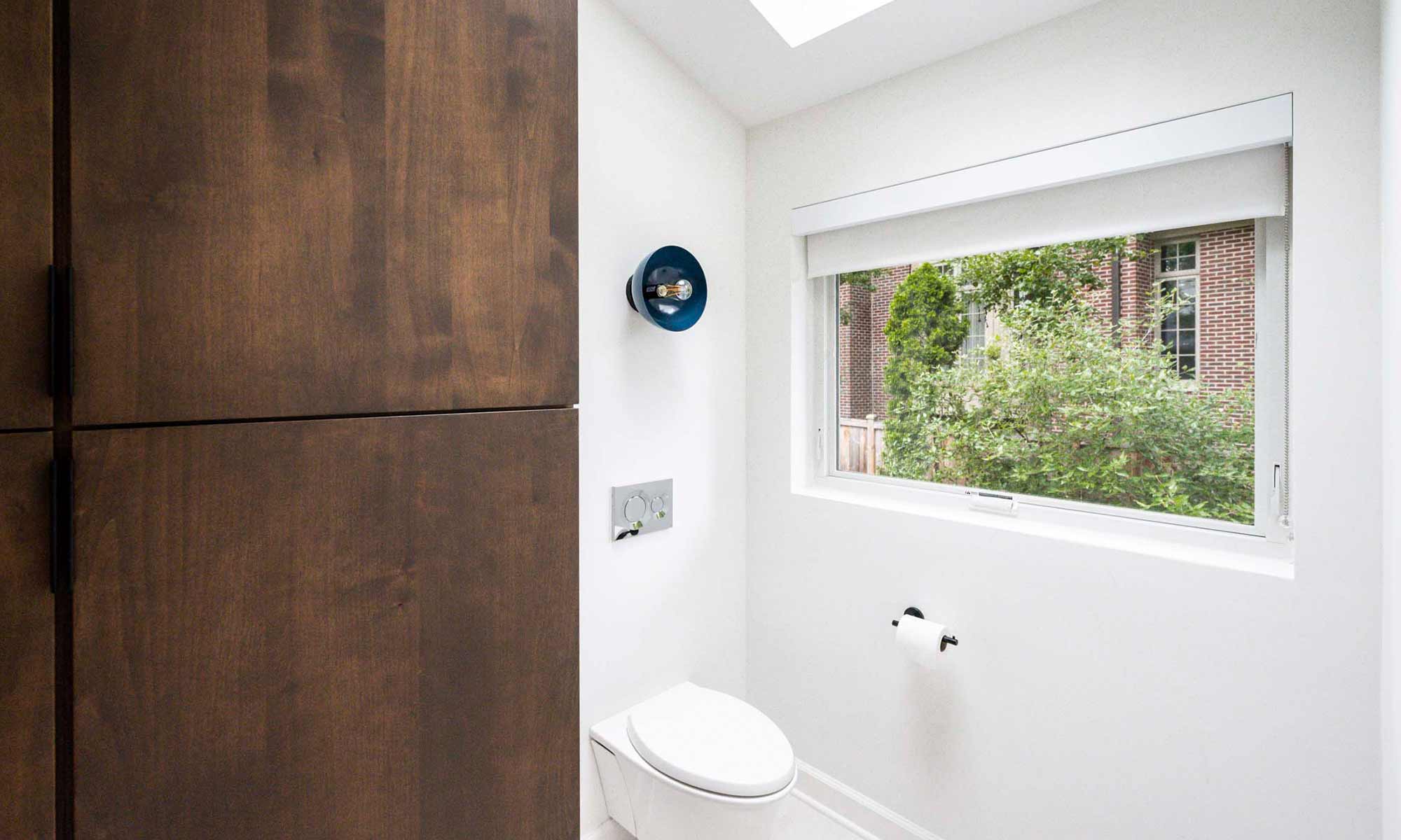 view of window over water closet in luxury hinsdale bathroom remodel by LivCo