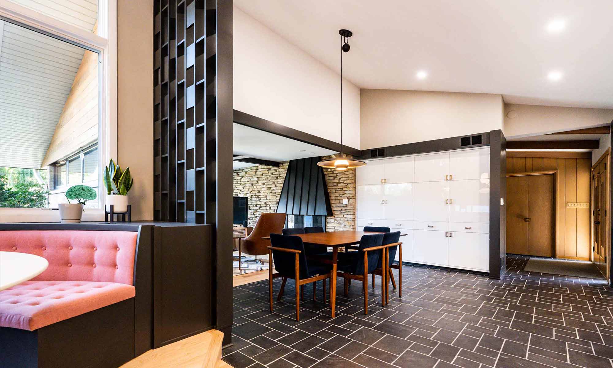 view of dining area and family room in luxury mid century remodel