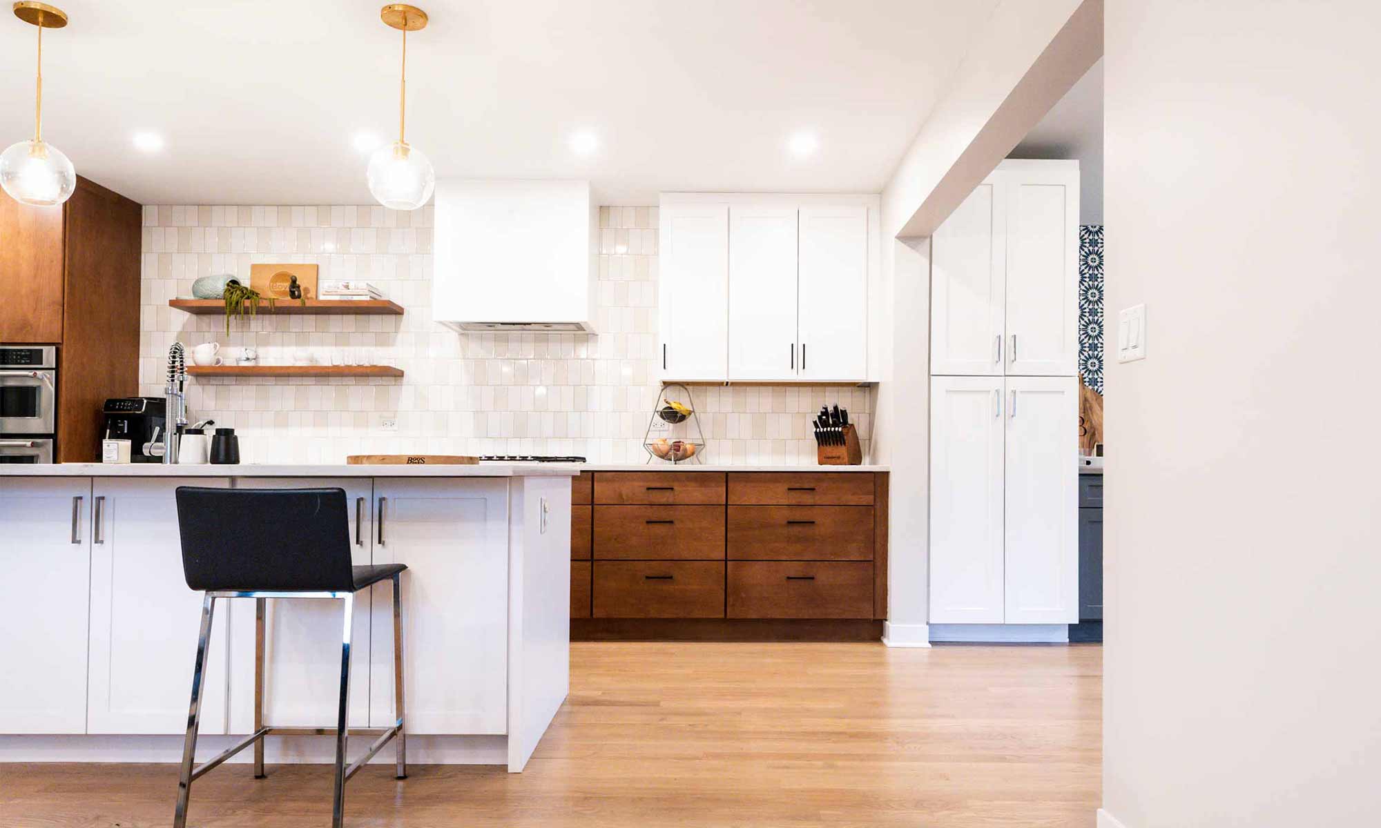 view of modern kitchen remodel with wood and white cabinets in western springs