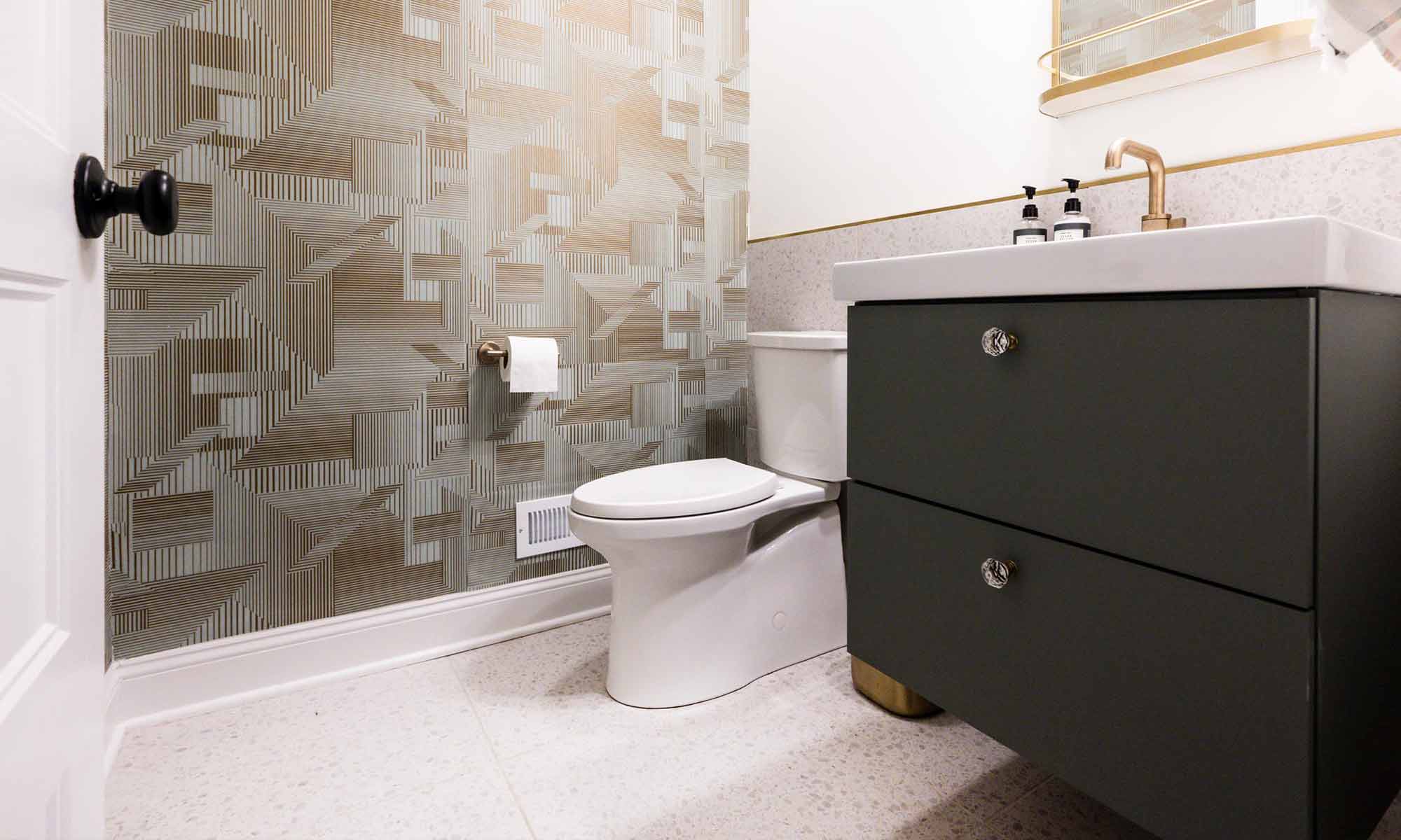 Luxury powder room remodel in Indian Head Park with textured geometric wallpaper and terrazzo flooring