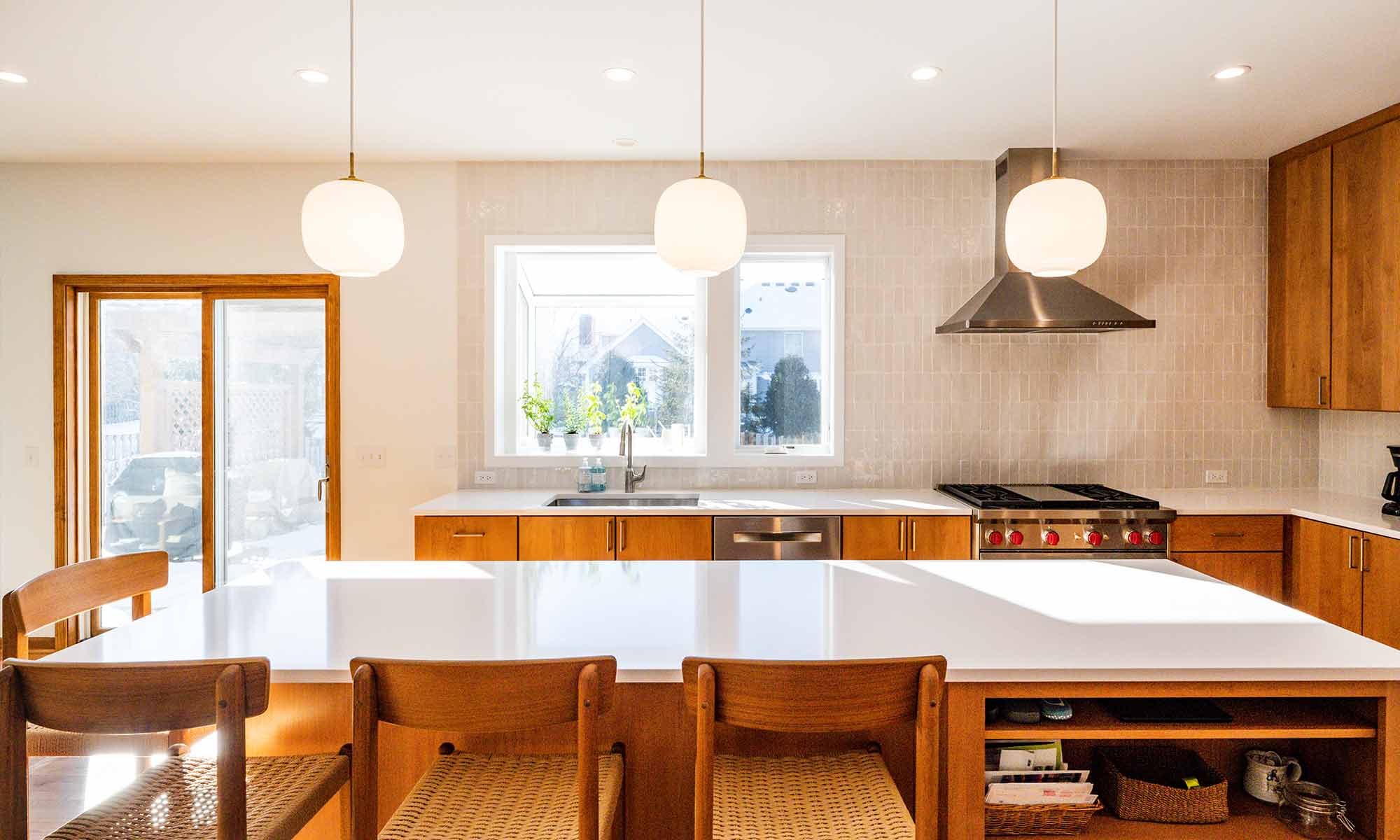 modern kitchen remodel with cherry cabinets open plan and white quartz island countertop