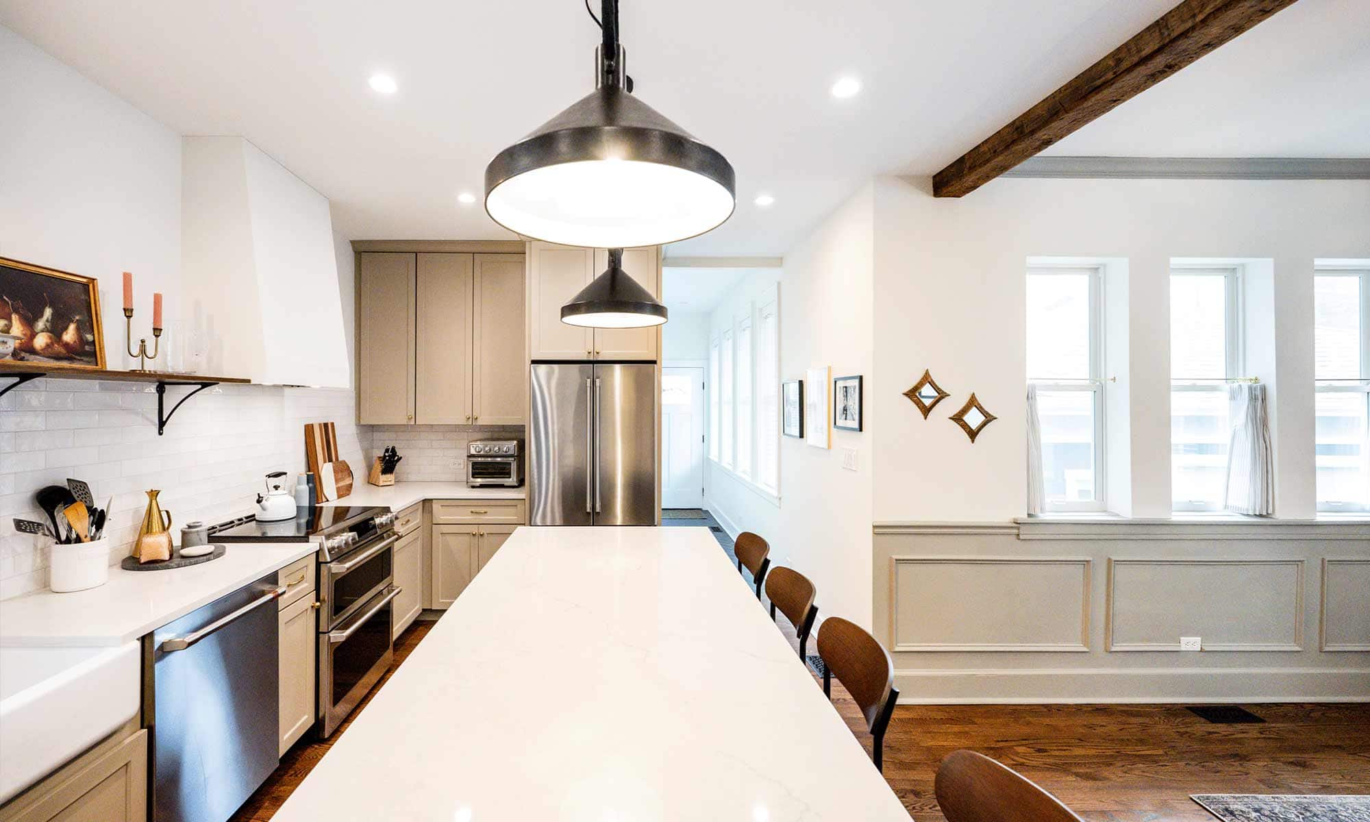 dark wood kitchen island with blue white and beige perimeter cabinetry in la grange park Illinois vintage kitchen remodel