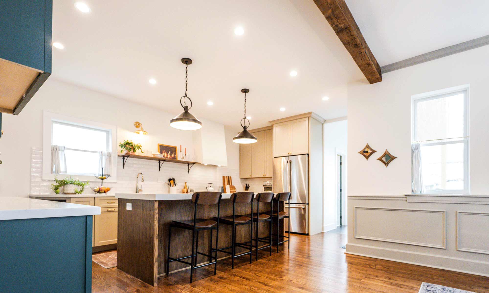 dark wood kitchen island with blue white and beige perimeter cabinetry in la grange park Illinois vintage kitchen remodel