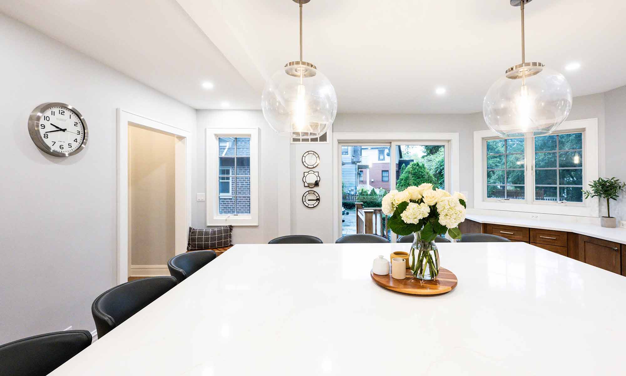 large kitchen island in luxury remodel with eight windows