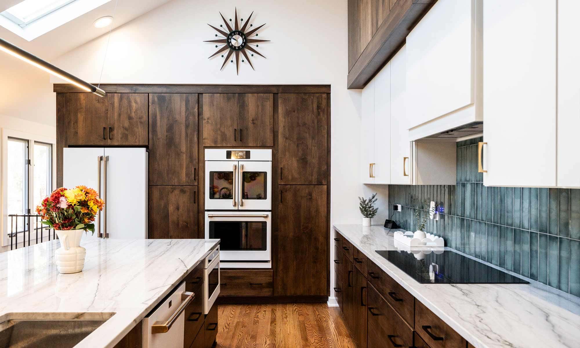 A modern kitchen featuring wooden cabinets and a spacious center island, creating an inviting cooking space.