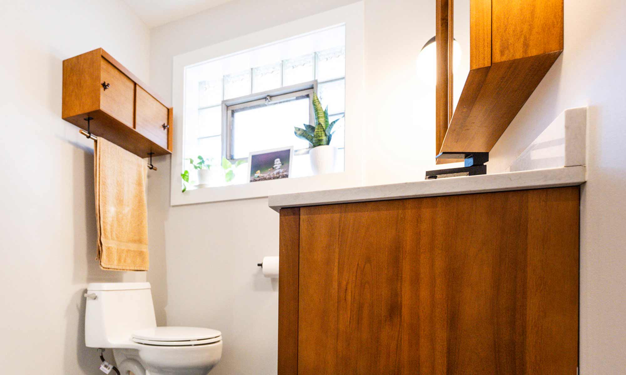 A bathroom featuring a shower and a blue tile floor, creating a serene and modern atmosphere.