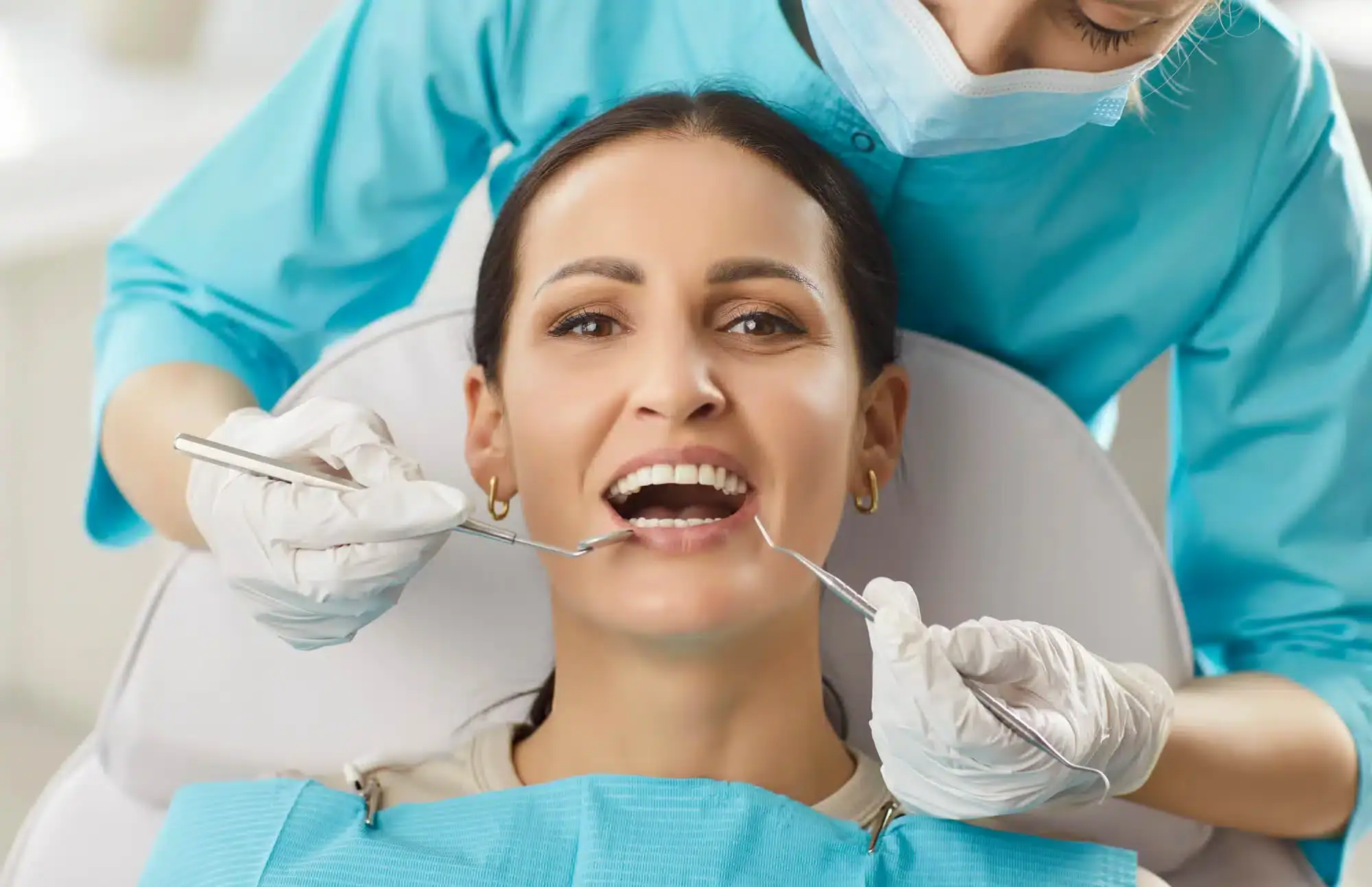 A-cosmetic-dentist-in-Riverview-MI-examining-patient