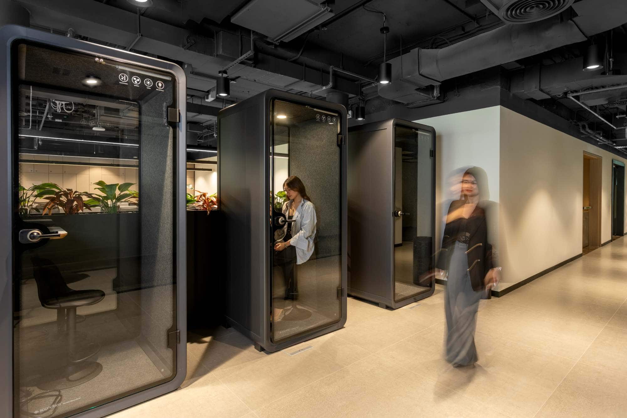 rivate acoustic pods at Sentinel Dubai co-working space, designed for focused calls and virtual meetings without distractions in a busy office environment.